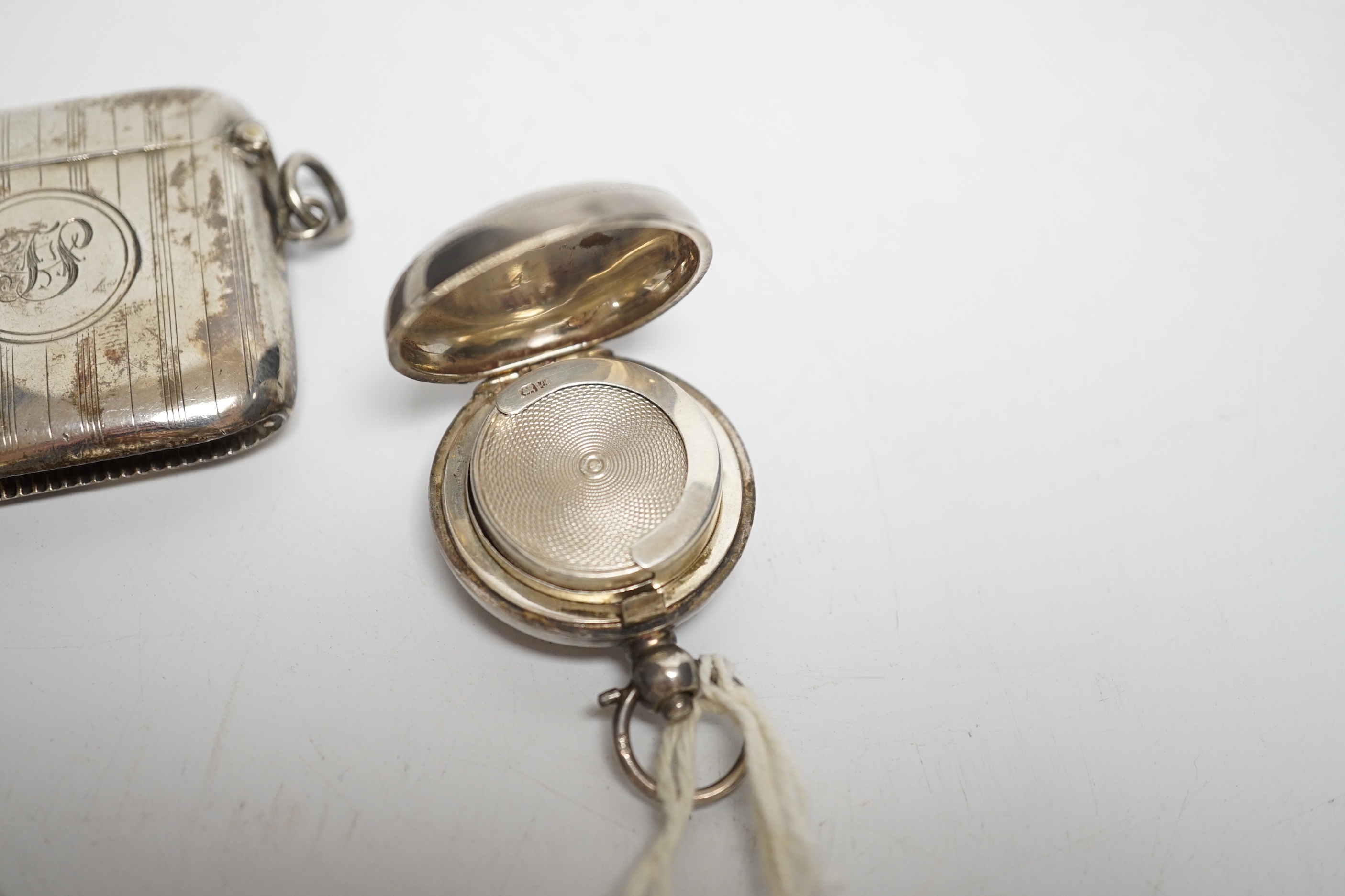 Two late 19th/early 20th century silver sovereign cases, 29mm and two silver vesta cases.